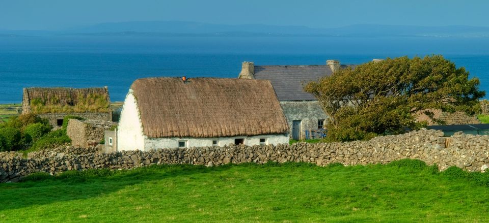  Traditional thatched cottage amid the landscape 
