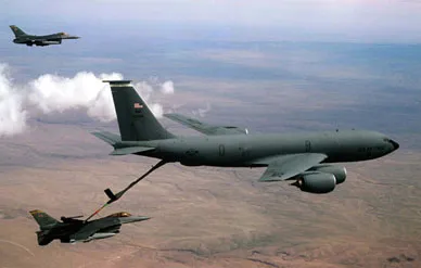 A KC-135 Stratotanker refuels an F-16 Fighting Falcon in the skies over New Mexico. (DoD photo by Senior Airman Jeffrey Allen, USAF)