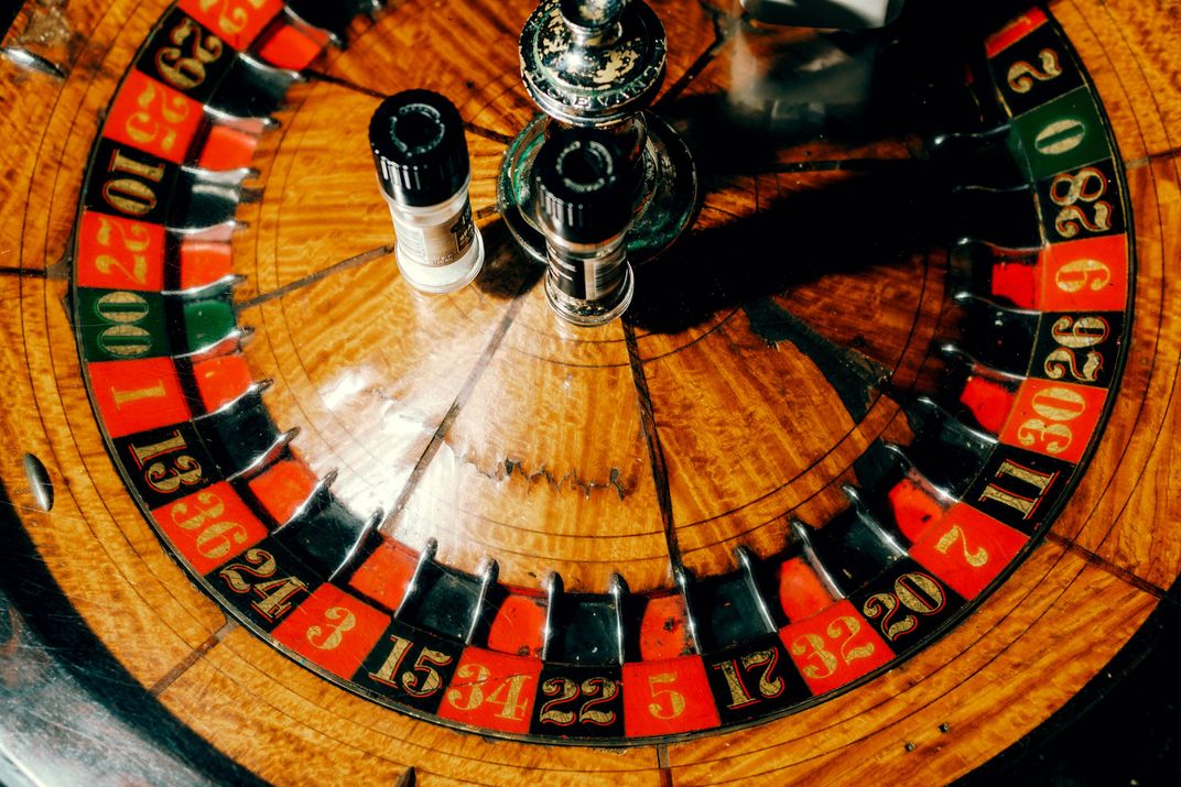 A vintage roulette wheel serves as a makeshift dining table in the Ohio Club, established in 1905 in Hot Springs.
